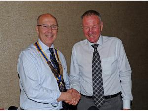 Geoff Bigg hands over his chain of office to new president Jeff MacCalman